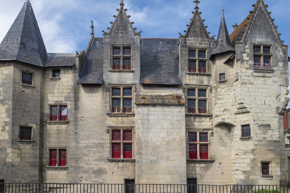 a large castle like building with red windows