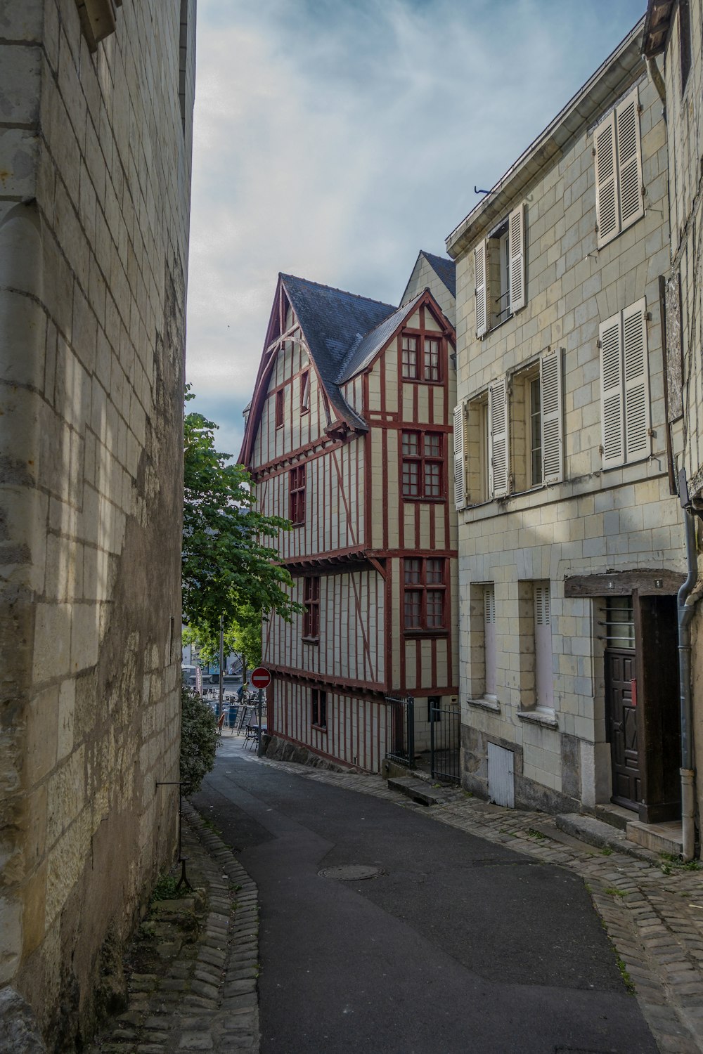 a narrow street with old buildings on both sides