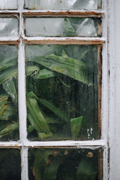 Close-up of a modern window with a sleek air vent installed, showing condensation-free glass.