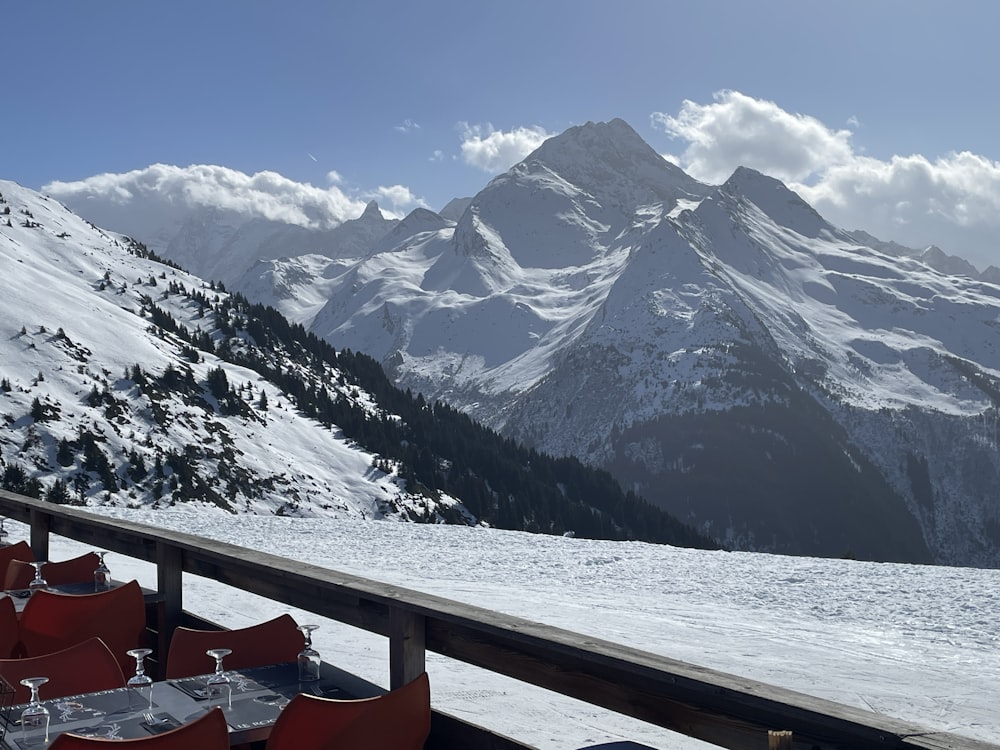 a view of a snowy mountain range from a restaurant