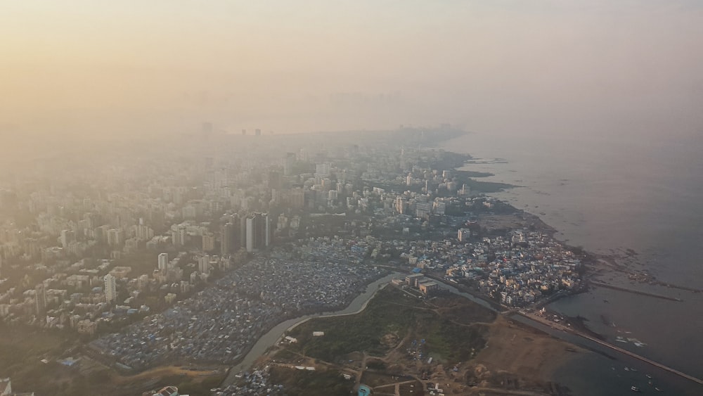 an aerial view of a city and a body of water