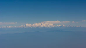 Panoramic view of the Andes mountain range under a clear sky, evoking strength and stability.