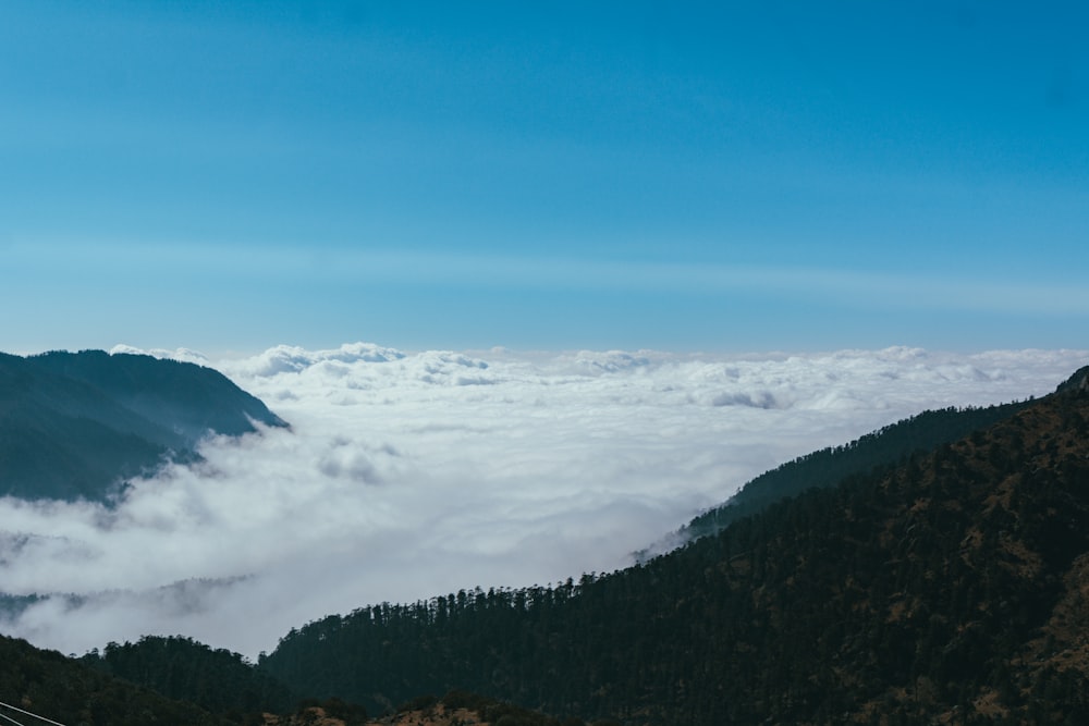 a view of a mountain covered in clouds