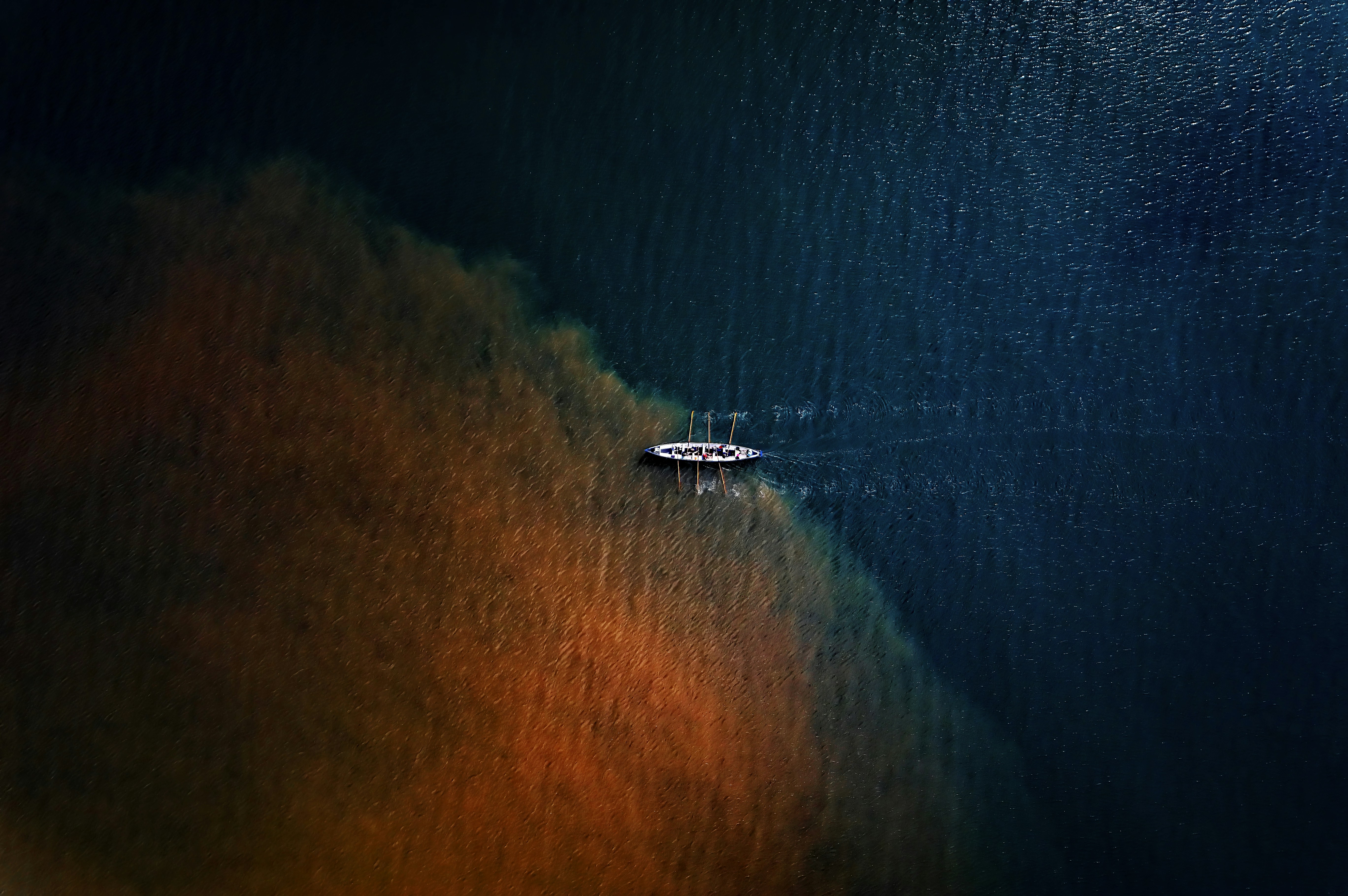 a boat floating on top of a body of water