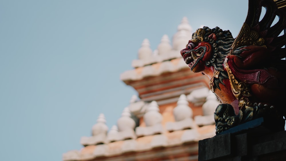 a close up of a statue on a building