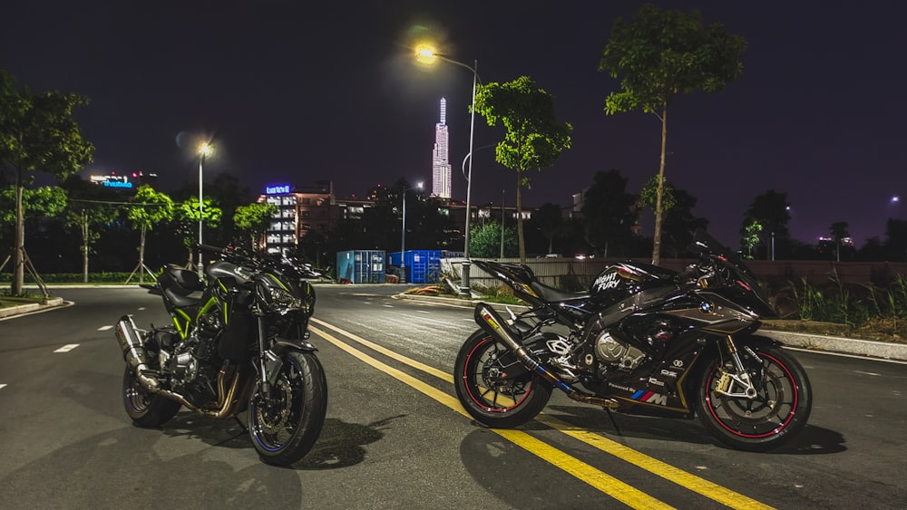 two motorcycles parked on the side of the road