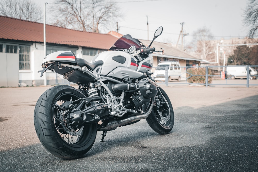 a motorcycle parked in a parking lot next to a building