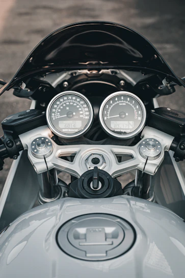 Close-up of a Honda motorcycle dashboard with modern controls and speedometer