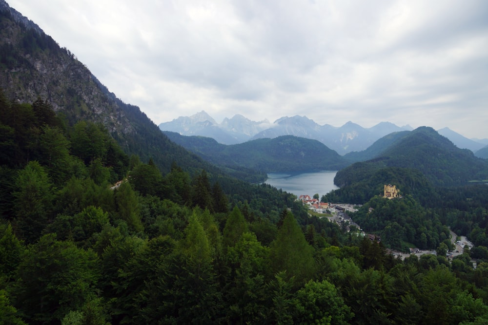 a scenic view of a lake surrounded by mountains