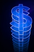 a lit up dollar sign sitting on top of a table