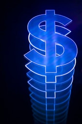 a lit up dollar sign sitting on top of a table