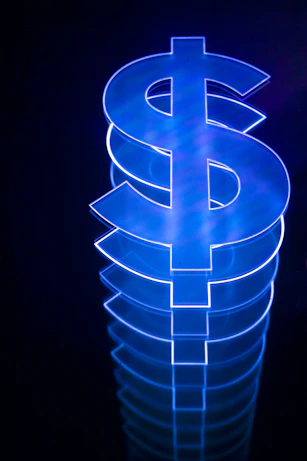 a lit up dollar sign sitting on top of a table