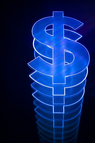 a lit up dollar sign sitting on top of a table