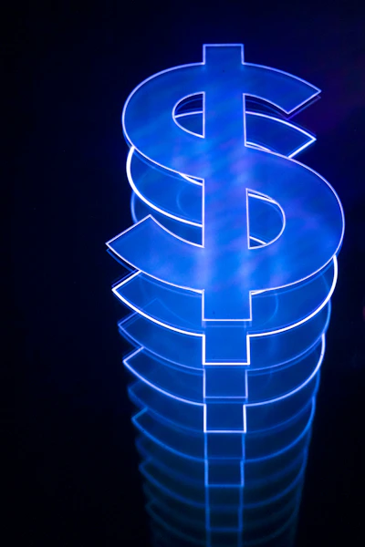 a lit up dollar sign sitting on top of a table