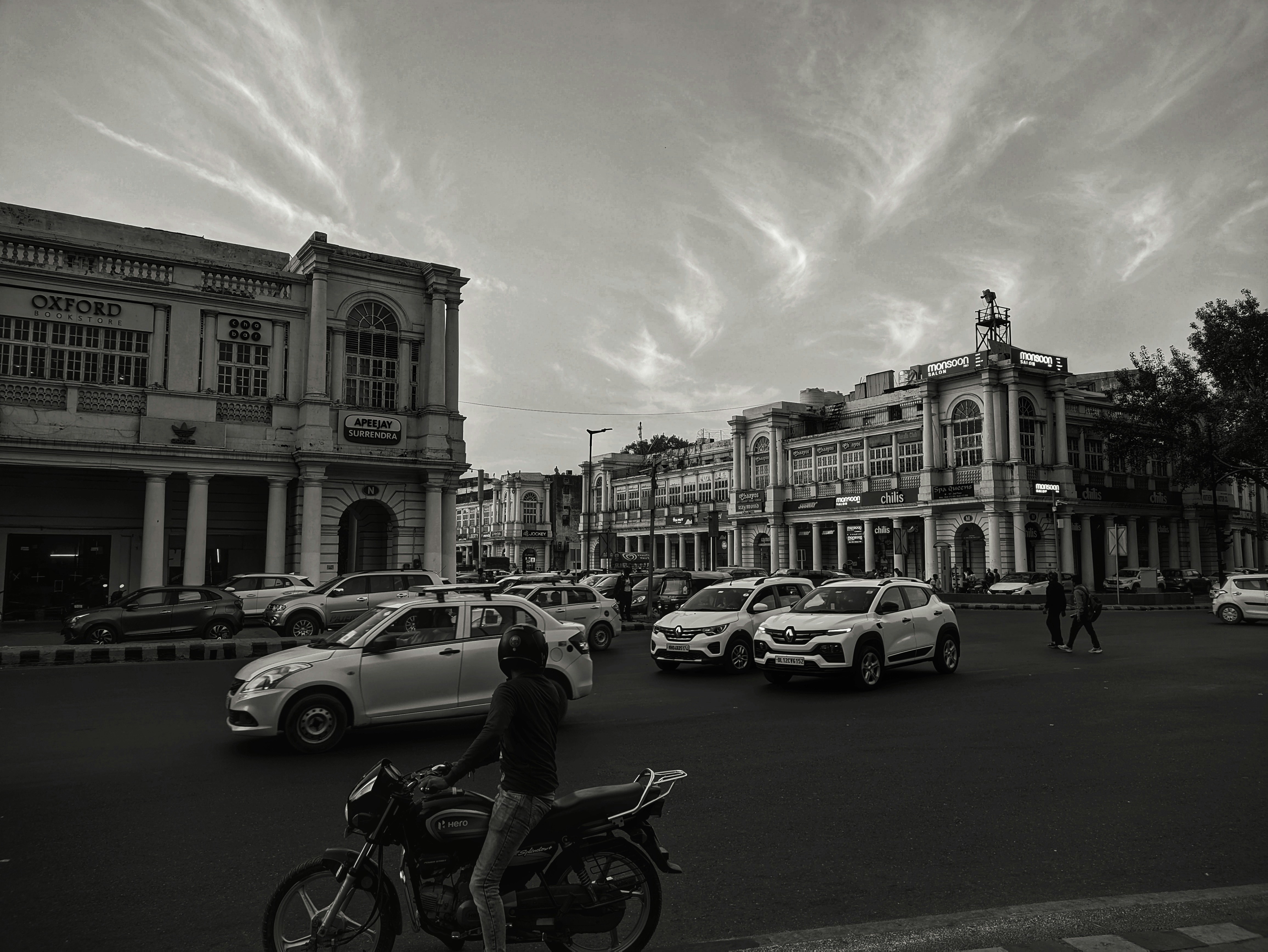 a black and white photo of a busy street