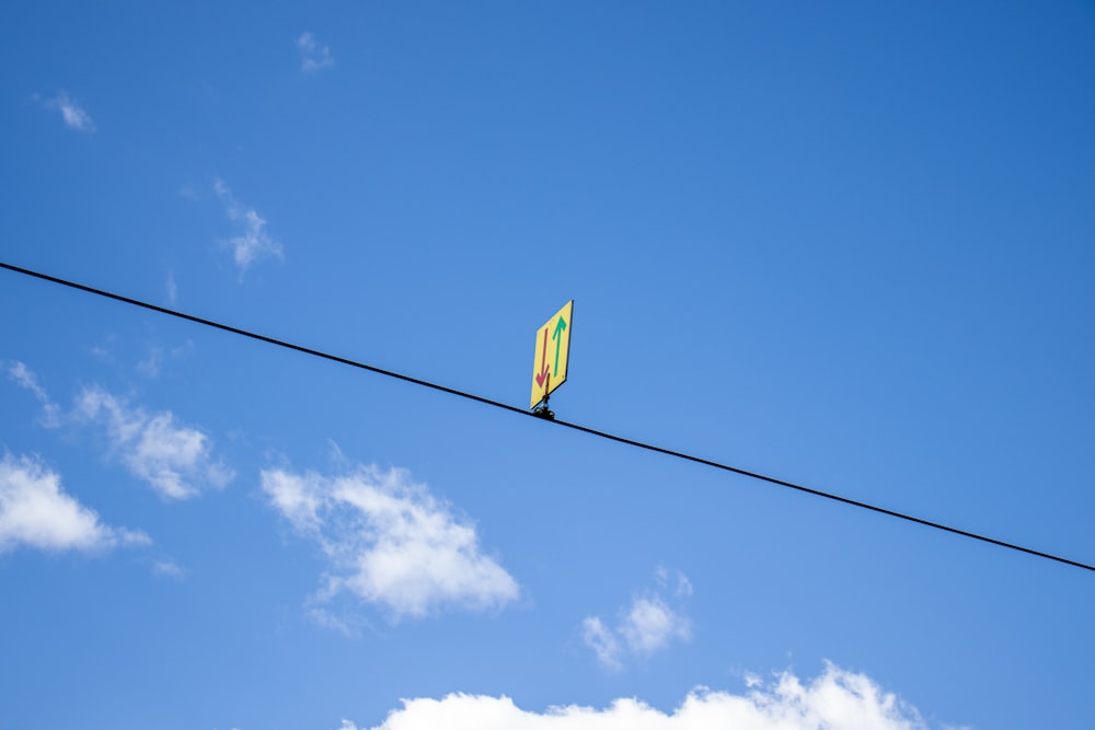 a kite that is sitting on a wire