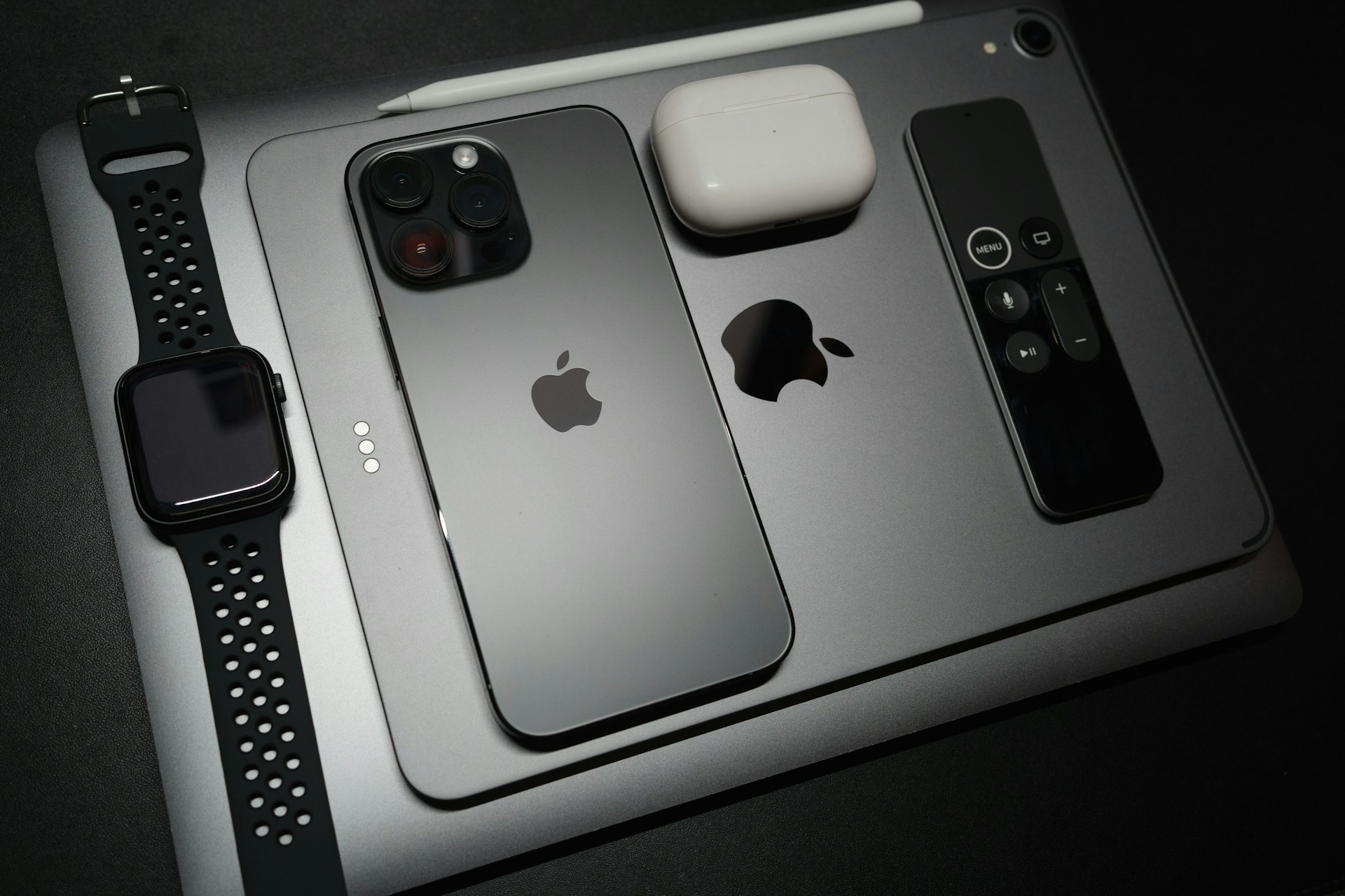 two iphones sitting on top of a table next to each other