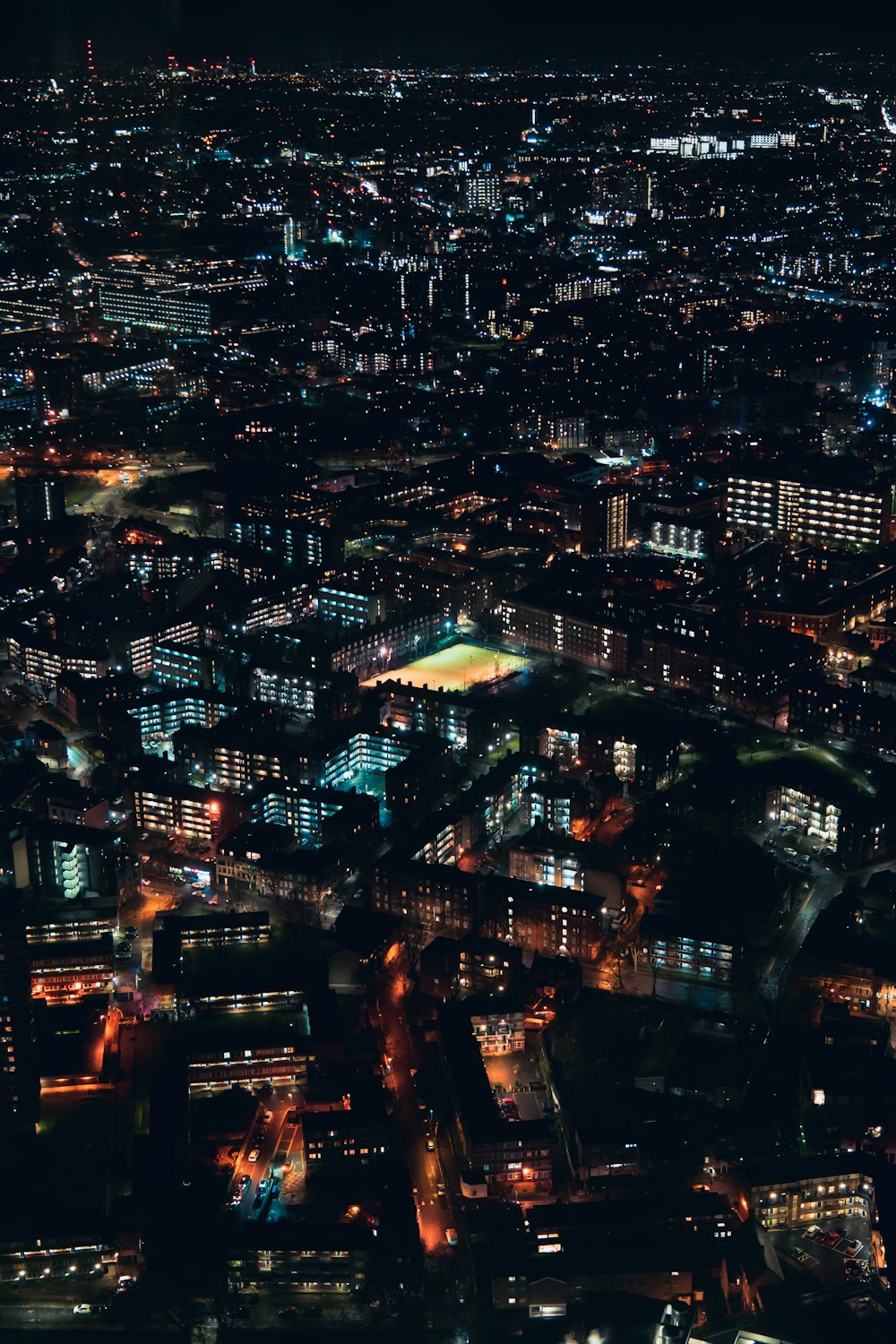 an aerial view of a city at night