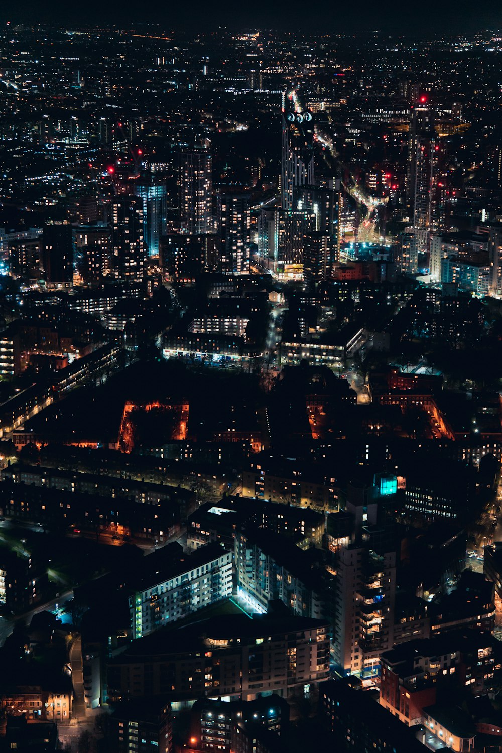 an aerial view of a city at night