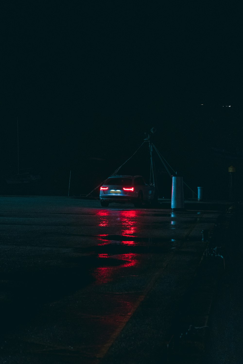 a car parked in a parking lot at night