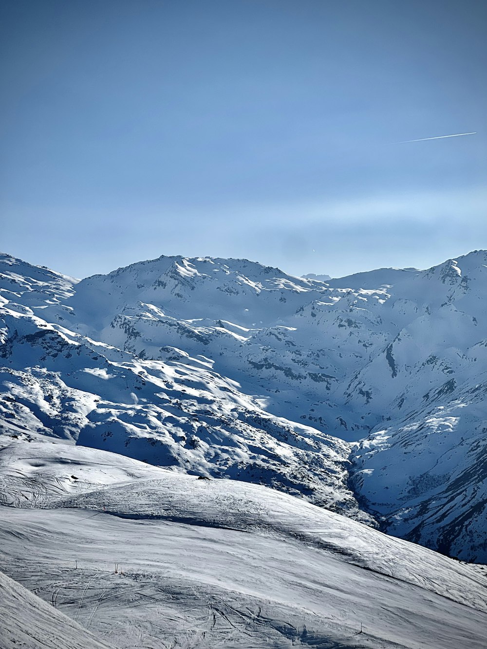 a man riding skis on top of a snow covered slope