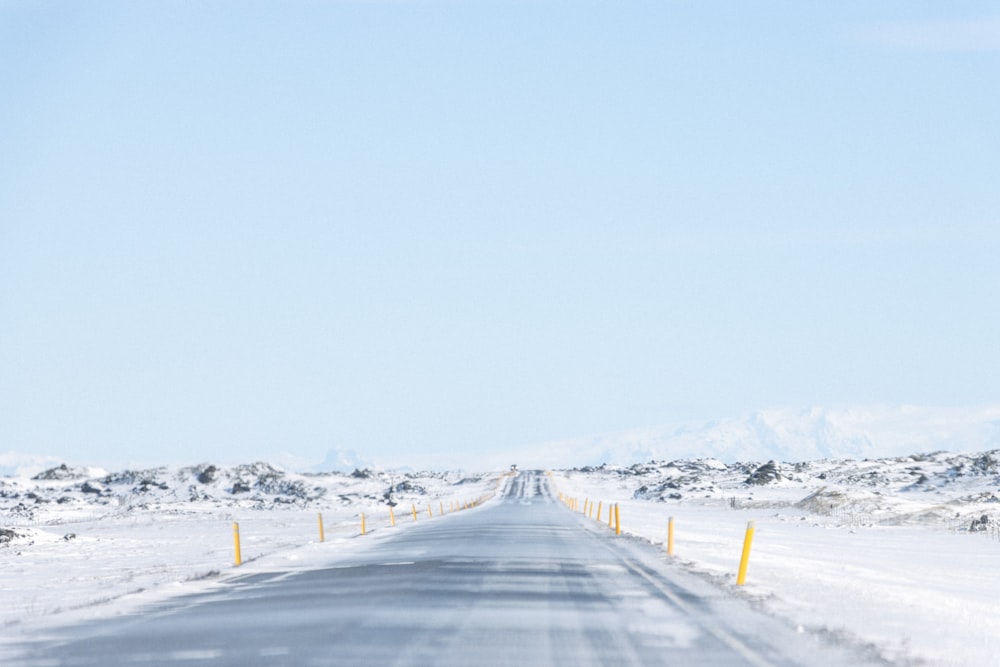 a snow covered road in the middle of nowhere