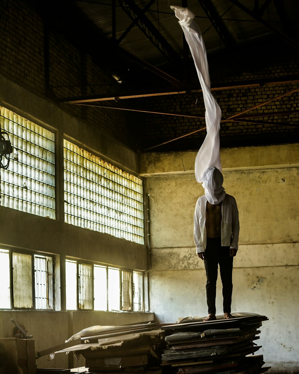 a person standing on top of a pile of papers