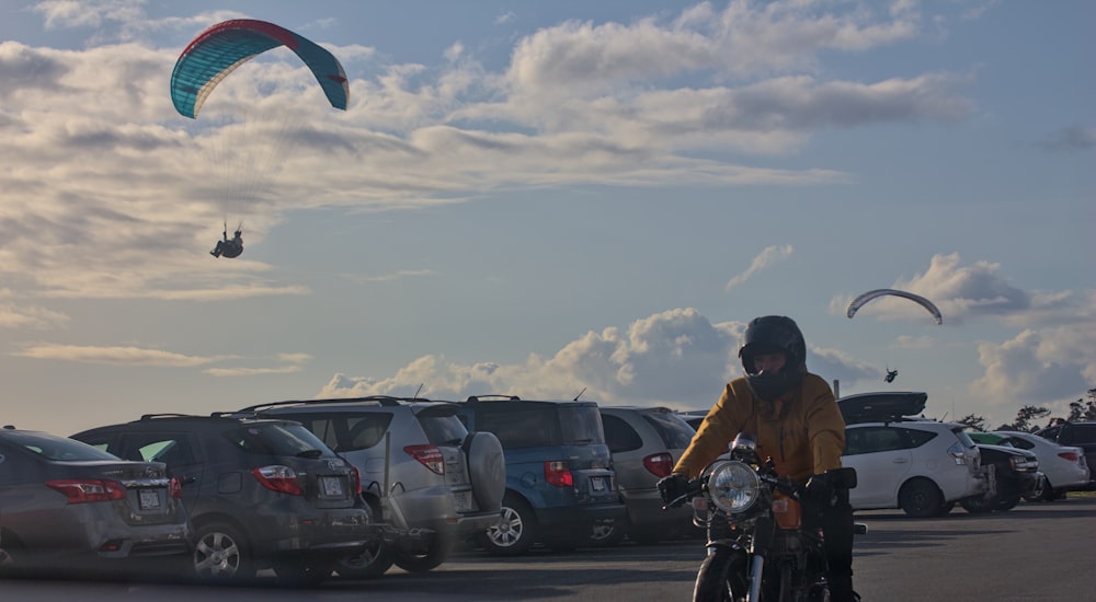 a person riding a bike in a parking lot