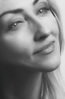 Close-up of a thoughtful face rendered with soft blues and grays, evoking calm and clarity.