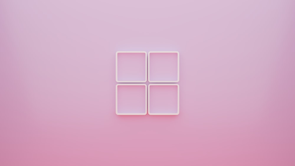 a pink background with four squares in the middle