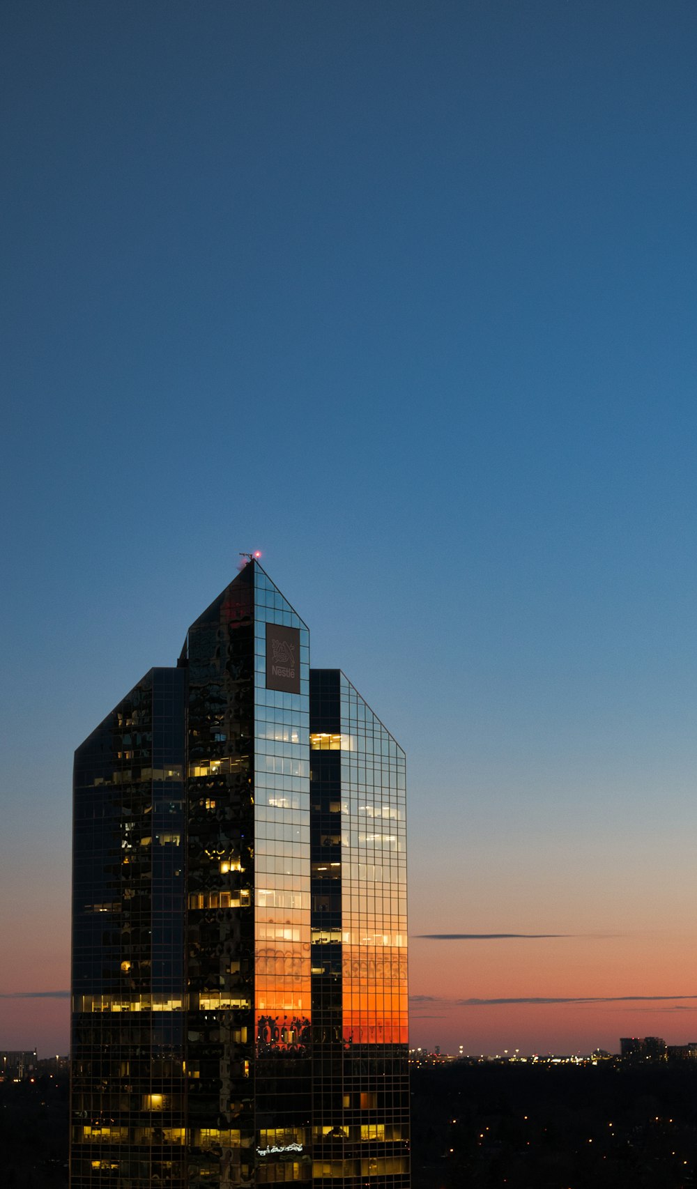 a very tall building sitting in the middle of a city