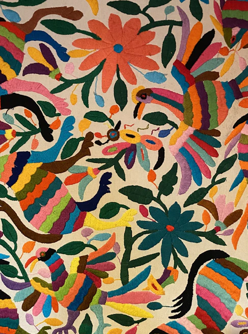 Detailed shot of a colorful animal embroidery from the collection