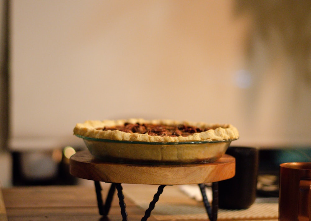 a pie sitting on top of a wooden table