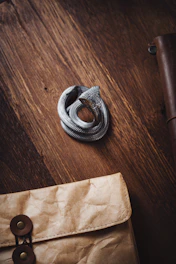 Engraved wooden plaque featuring a coiled snake design