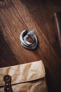 Engraved wooden plaque featuring a coiled snake design