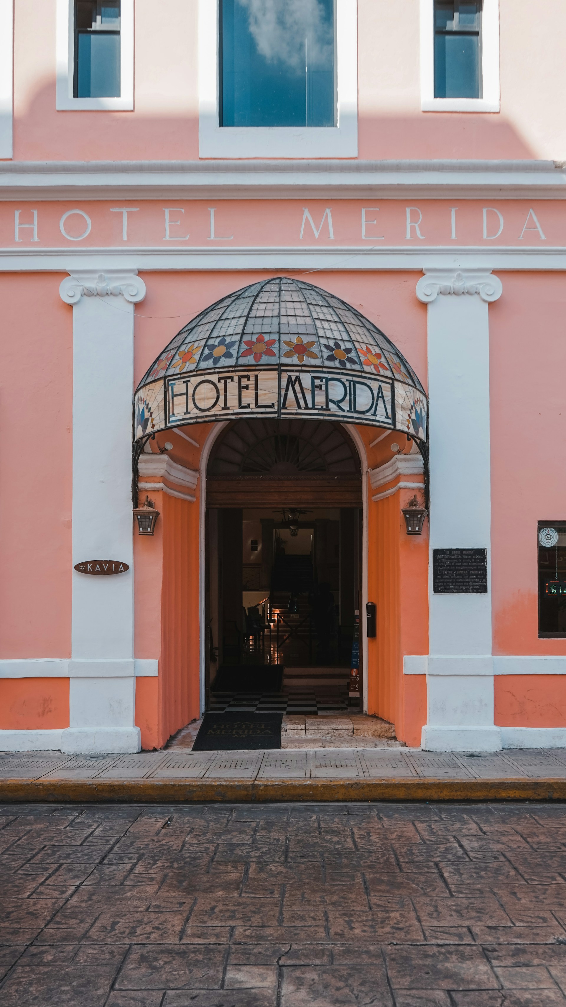 woman wearing yellow long-sleeved dress under white clouds and blue sky during daytime