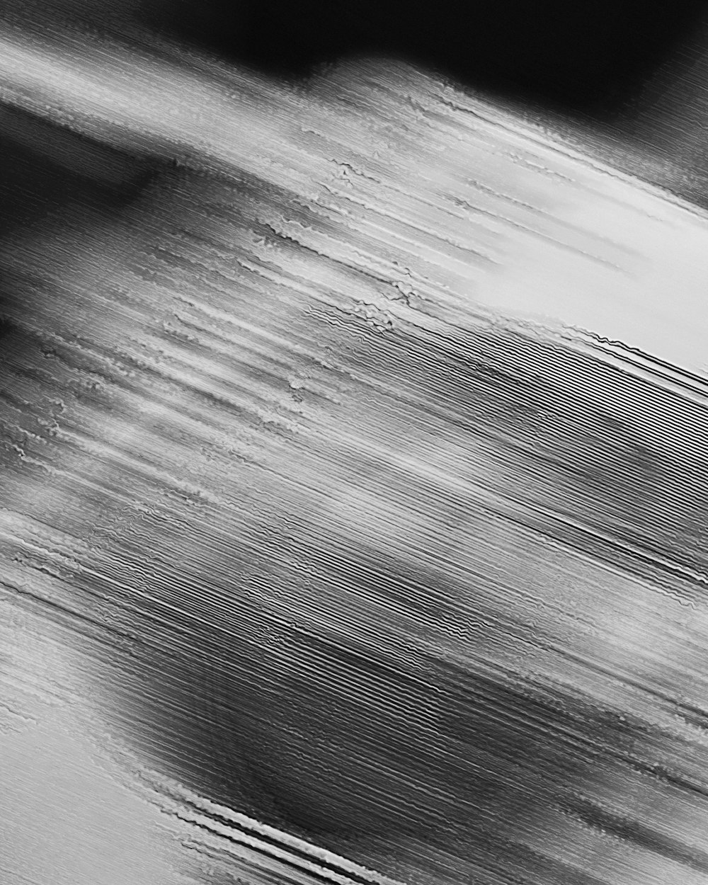 a black and white photo of a person riding a skateboard