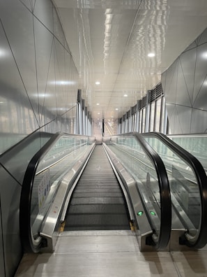 Close-up of a moving walkway in an airport terminal, emphasizing the clean lines and efficient mechanics.