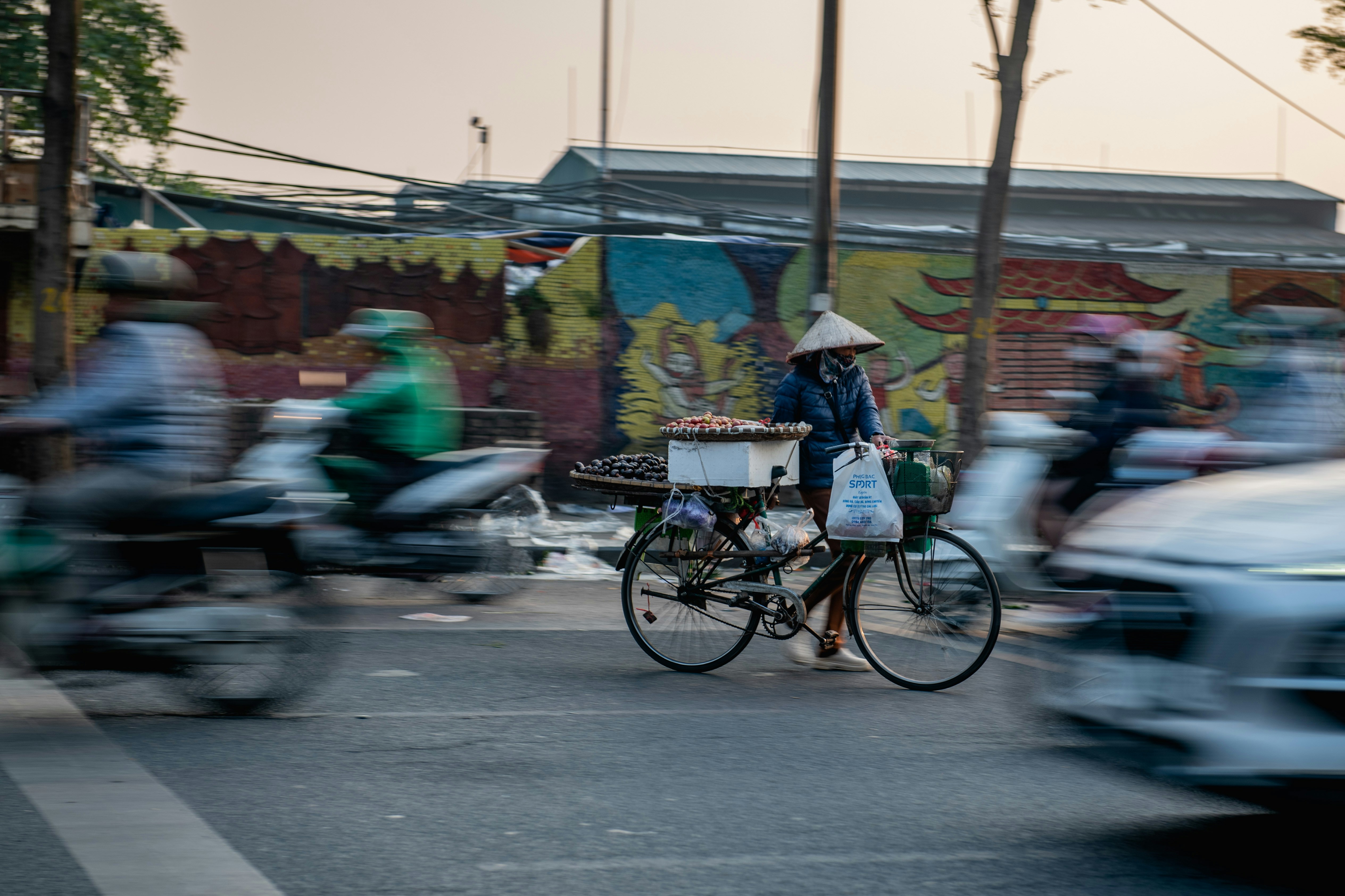 a person riding a bike down a street