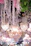 Elegant wedding venue adorned with lush floral arrangements and soft golden lighting.