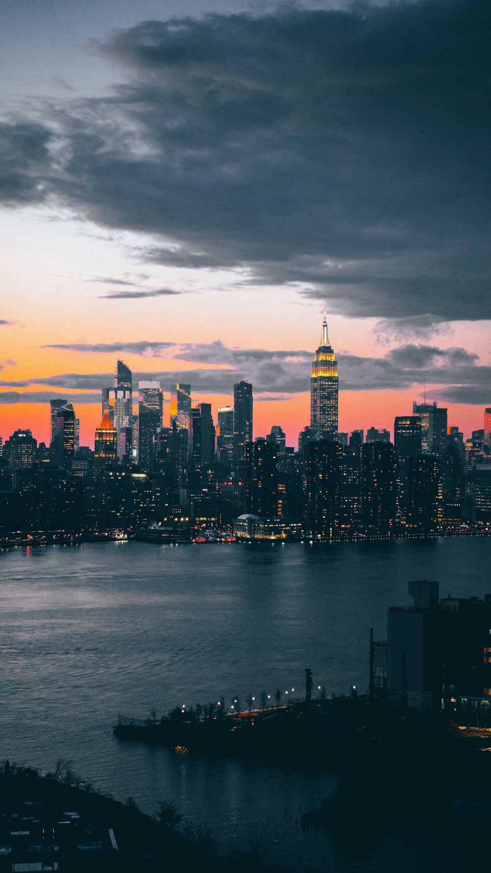 a view of a city skyline at dusk