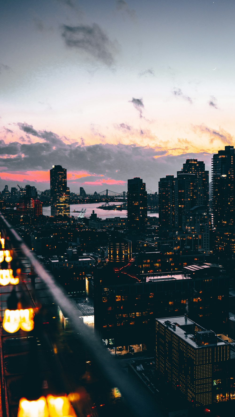 a view of a city at night from a tall building