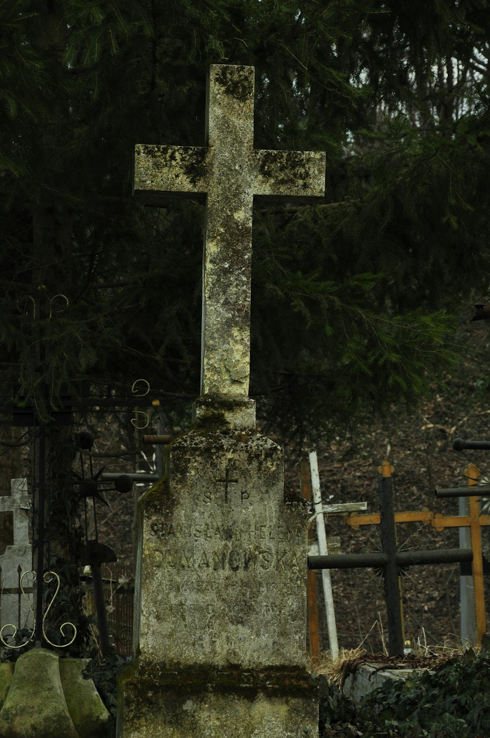 a cemetery with a cross on the top of it