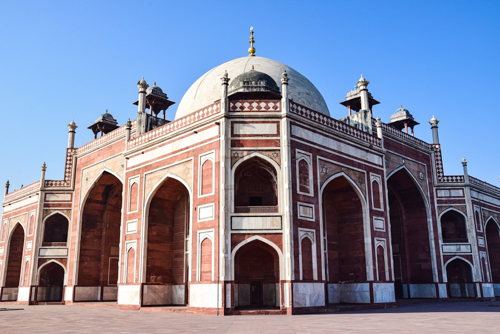 a red and white building with a dome on top