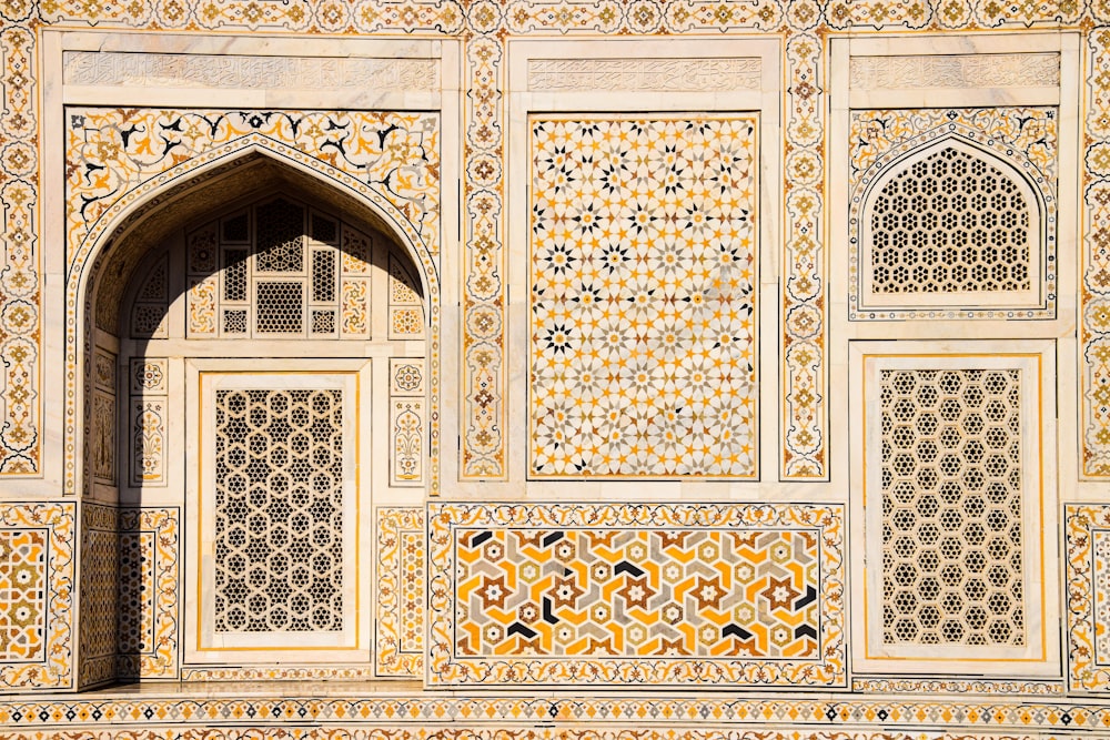 a close up of a wall with a decorative arch