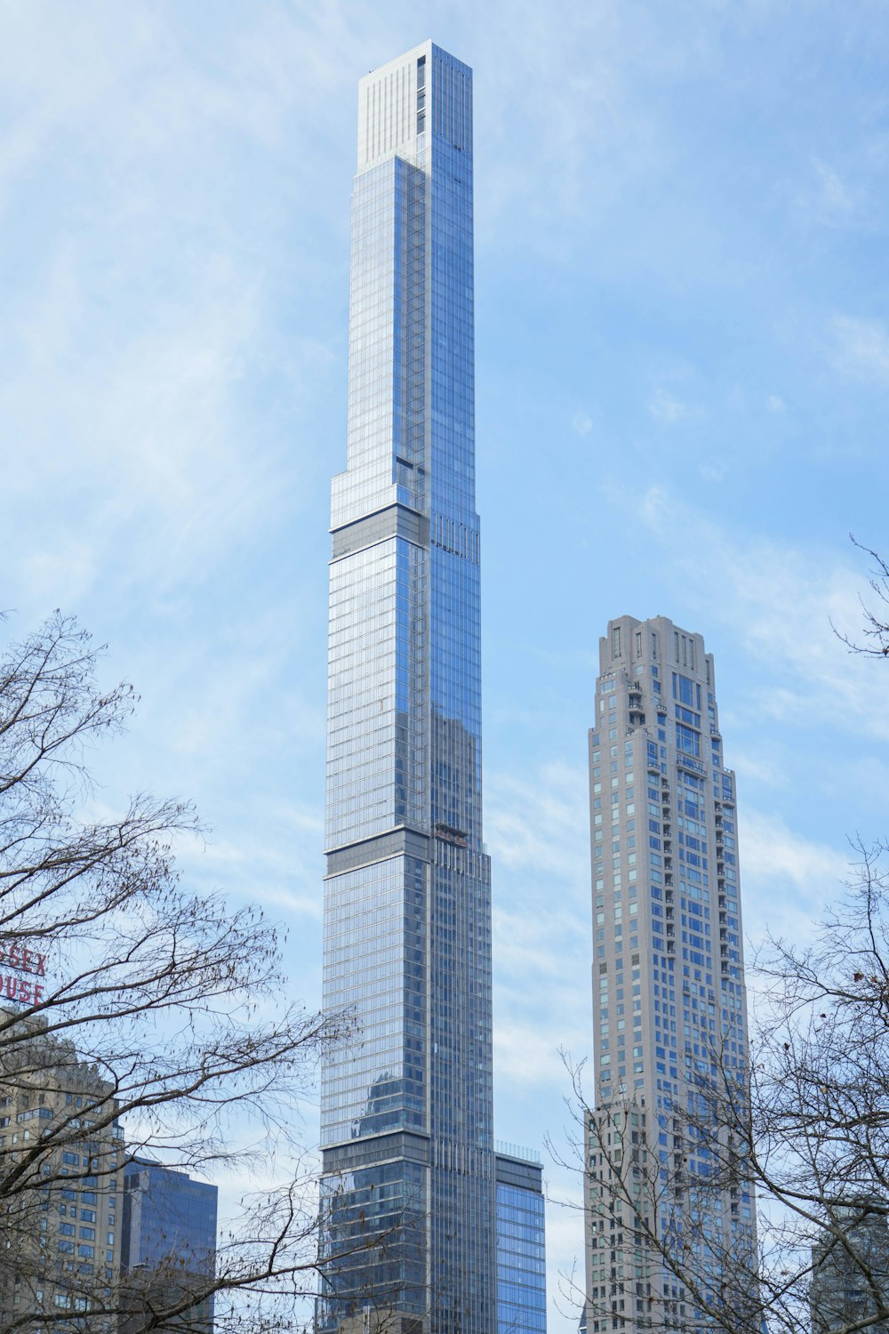 a very tall building towering over a city