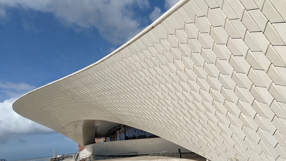 a large white building with a sky background