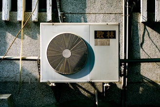 a wall mounted air conditioner mounted on the side of a building