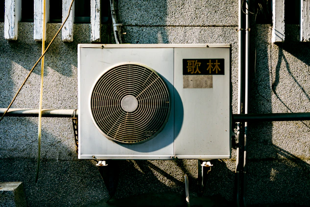 a wall mounted air conditioner mounted on the side of a building