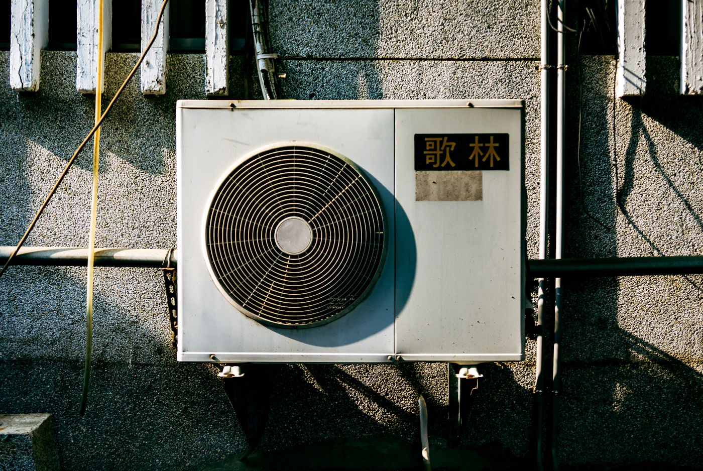 A wall-mounted mini-split heat pump head unit